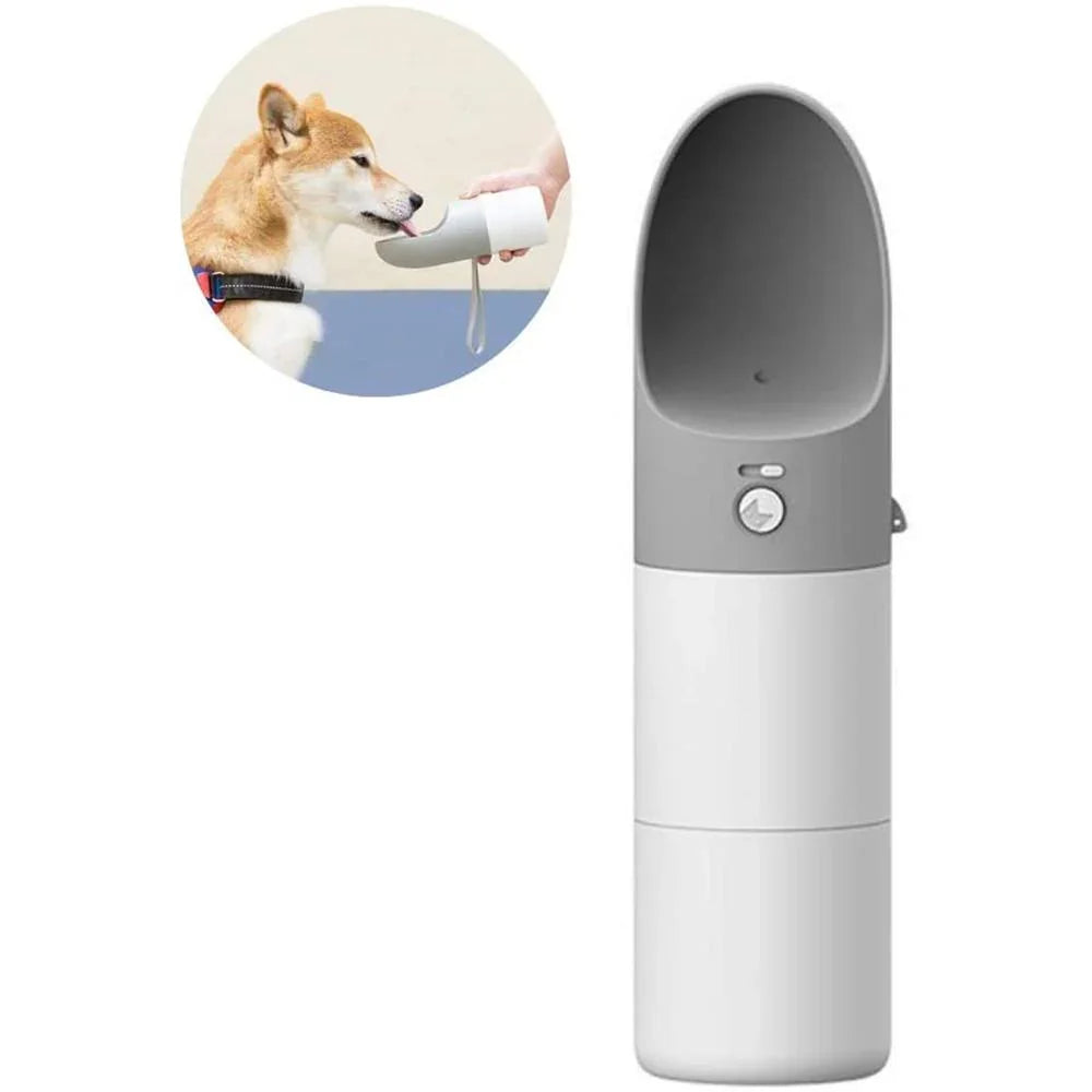 Portable pet water bottle with a dog drinking from it on a white background